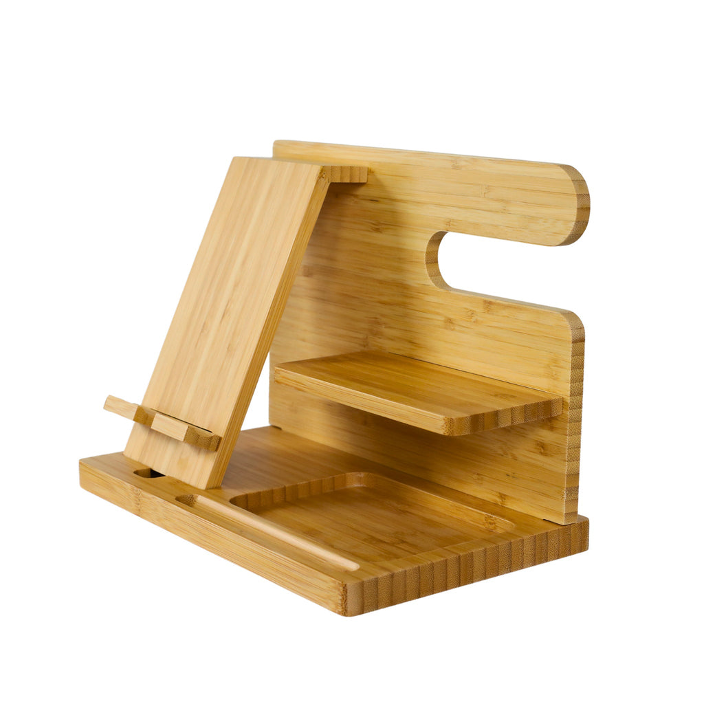 The Light Wood Charging Shelf/Valet features a bamboo design with smooth edges, a natural finish, a phone or tablet stand, charging shelf, and compartments for organized storage.
