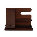 The Dark Wood Charging Shelf/Valet is a modern organizer with a phone or tablet stand, small shelf, and tray. Its minimalistic dark brown design keeps essentials tidy, featuring a convenient charging shelf for devices.