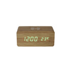 The Bamboo Wireless Phone Charger/Digital Clock displays 12:00 and 23°C in green, with a wireless charging symbol on top, shown on a plain white background.
