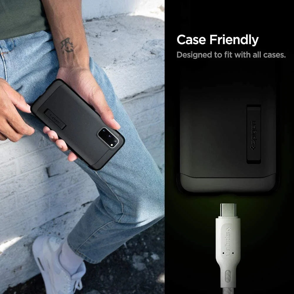 A person in jeans and a gray shirt holds a phone with a black Spigen case. To the right, text reads "Case Friendly. Designed to fit with all cases." Below is the Spigen DuraSync 60W USB C to USB C High Speed Fast Charging Cable (4.9FT, 2 Pack).