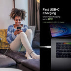 A woman smiles at her phone while it charges with the Spigen DuraSync 60W USB C to USB C High Speed Fast Charging Cable (4.9FT, 2 Pack). Text beside her reads: "Fast Charging—up to 60W.* Use with USB-C PD charger," with a laptop charging nearby.