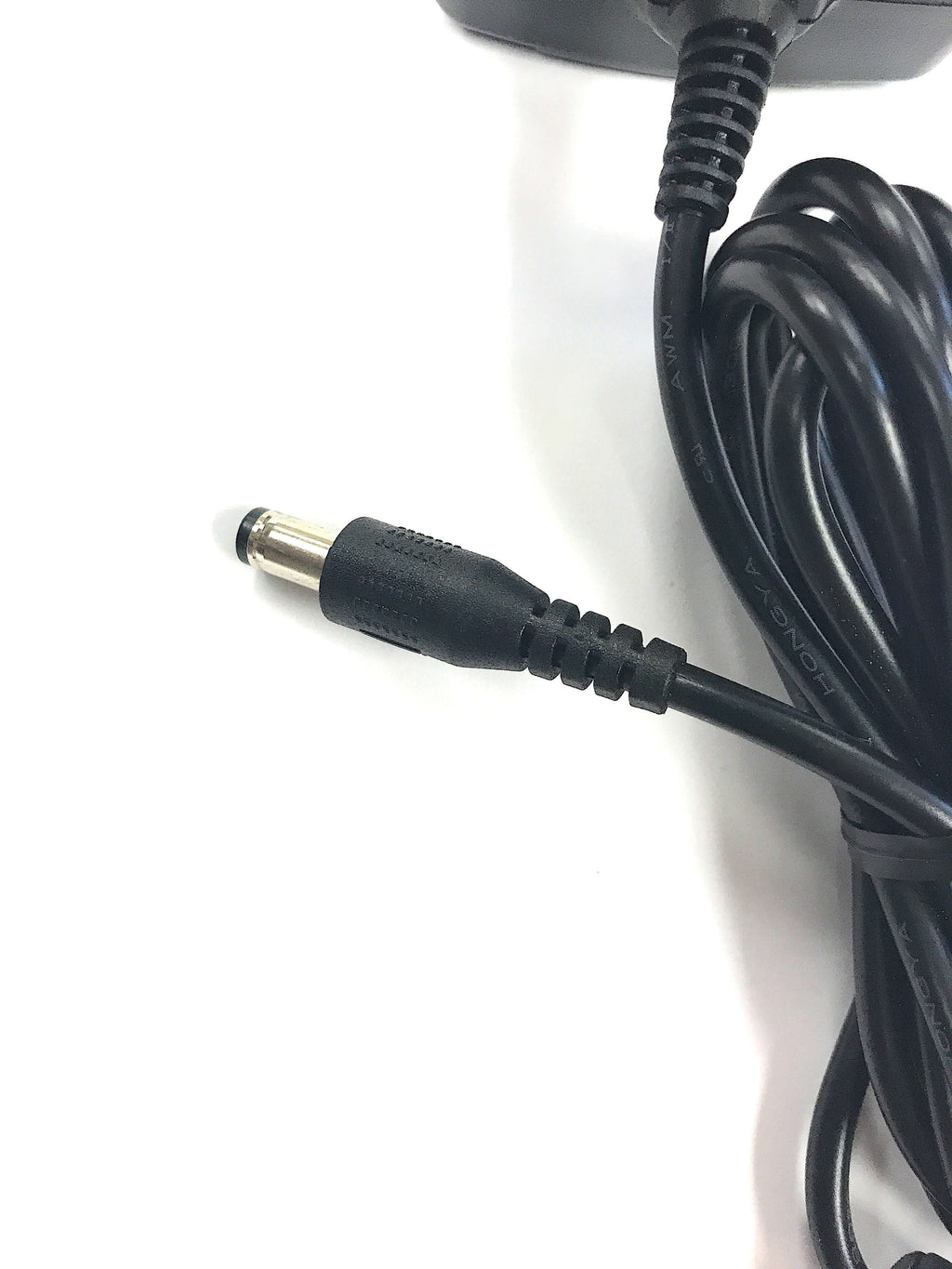 A close-up of the Naxa AC Adapter Power Supply Charger (12V, 3A, 36W, 2.1mm x 5.5mm) for LED LCD TVs up to 15", featuring a black coiled cable with barrel plug connector on a white surface.
