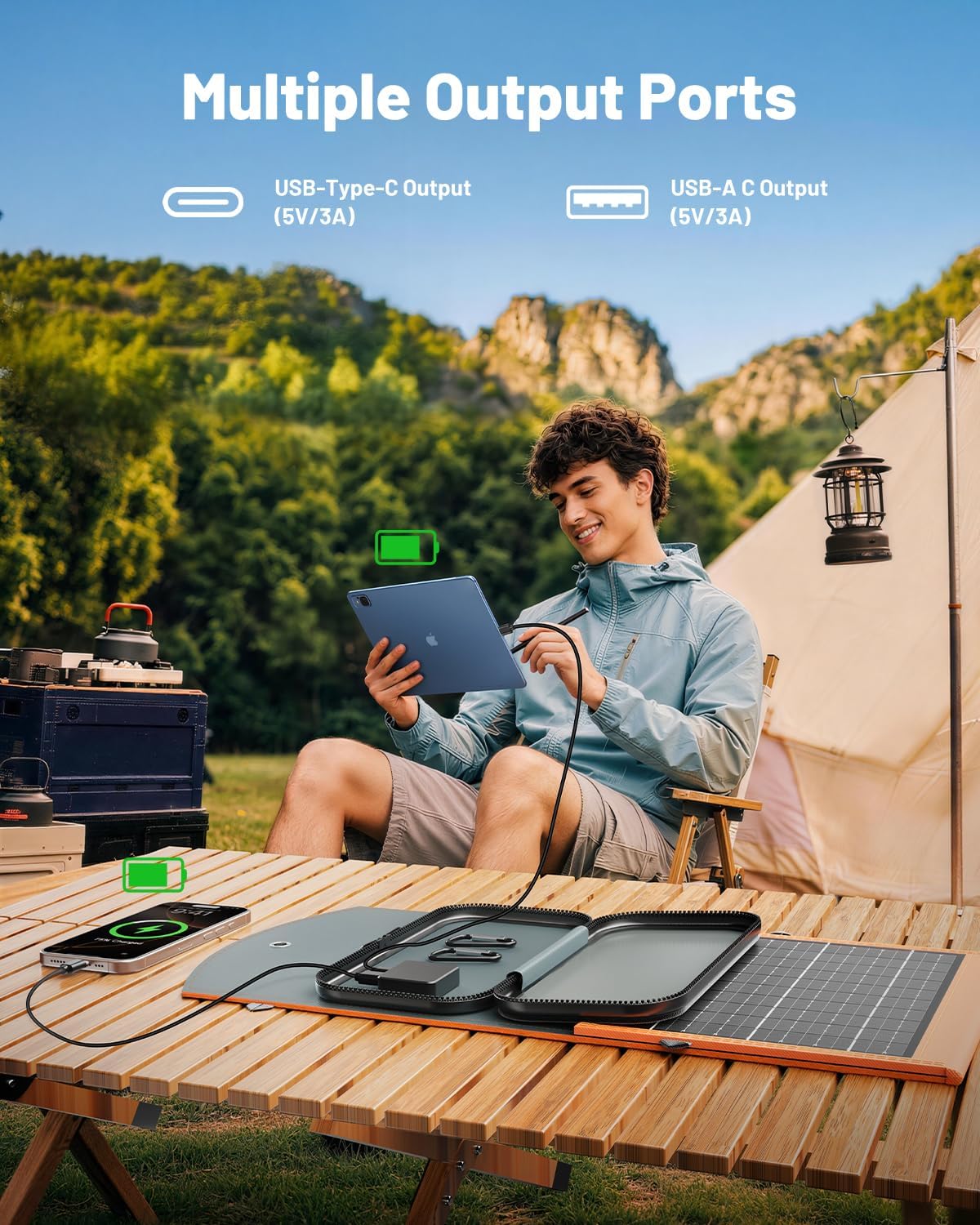 A young man sits outdoors by a tent, using his tablet and phone connected to the 30W Portable Foldable Solar Charger on a wooden table. The text highlights its multiple output ports—USB-C and USB-A—making it perfect for fast solar charging of phones, tablets, and power banks while camping.
