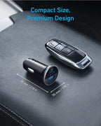 A black Anker 323 Car Charger (52.5 W) and a car key fob rest on a car’s leather console. Text above reads “Compact Size, Premium Design.” The charger measures just 55 mm x 30 mm (2.16 in x 1.18 in).