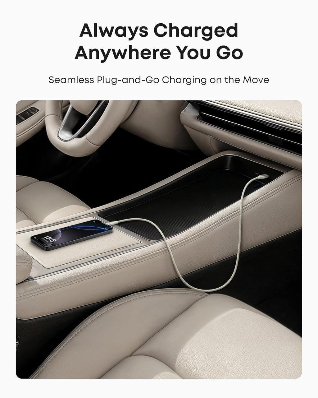 A smartphone with an Anker USB-A to USB-C Cable (3 ft, Upcycled-Braided) sits on the center console of a car with beige leather seats, highlighting convenient and reliable in-car charging. Text above reads, "Always Charged Anywhere You Go.