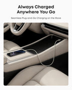 A smartphone with an Anker USB-A to USB-C Cable (3 ft, Upcycled-Braided) sits on the center console of a car with beige leather seats, highlighting convenient and reliable in-car charging. Text above reads, "Always Charged Anywhere You Go.