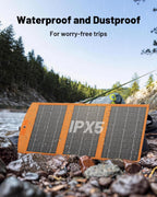 A vibrant orange 30W Portable Foldable Solar Charger – USB-C & USB-A Fast Charging Solar Panel for Phones, Tablets & Power Banks, featuring an IPX5 rating, sits by a rain-kissed riverside surrounded by trees. The text reads: "Waterproof and Dustproof. For worry-free trips—ideal solar charging companion for camping.