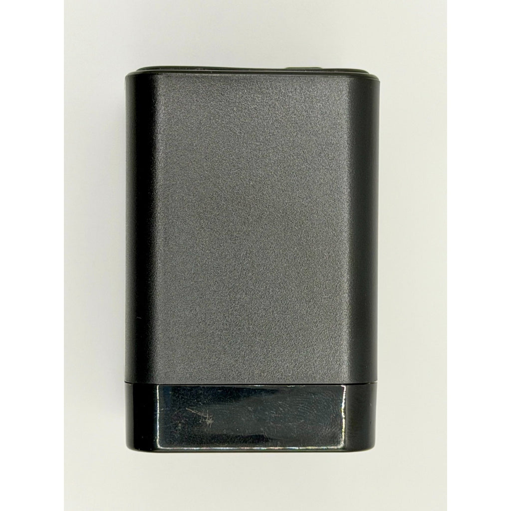 A rectangular, black 65W GaN USB-C Wall Charger with Built-In Cable & Foldable Plug is shown against a plain light background; its slightly glossy plastic finish is visible.