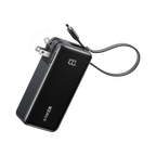 A black Anker Power Bank (10K, Fusion, Built-In Cable) with a digital display reading "100%" and a foldable wall plug. Its charging cable extends outward, all set against a plain white background.