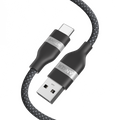 A close-up of the Anker USB-A to USB-C Cable (3 ft/6 ft, Upcycled-Braided), featuring a durable black and gray upcycled-braided design with "ANKER"-labeled metallic connectors made from recycled materials.
