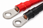 Close-up of 4 AWG Battery Inverter Cables 5FT with 3/8 in ring terminals; one red, one black, showing exposed copper—perfect for use as inverter cables in solar power systems.