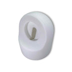 The Charging Stand is a white, oval-shaped plastic wall hook with a central slot and protruding hook—practical and modern, ideal for organizing spaces or travel, just like a portable Apple Watch charging stand.