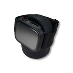A black smartwatch with a square face and black strap is wrapped around a Charging Stand, set against a plain white background.