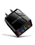 The USB Wall Charger Plug Block Cube 4 Port is a glossy black Quick Charge 3.0 charger with red, blue, green, and white "3.1A" USB ports and two flat prongs—perfect as a fast portable iPhone wall charger.