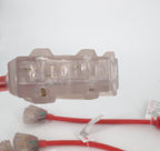 Close-up of a 50 Amp Generator Adapter Cord (14-50P to 3x 5-15R Outlets) connected to a red heavy-duty cable, with two similar red cables and adapters in the background on a white surface.