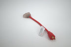 A 30 Amp Generator Adapter Cord (L5-30P to 3x 5-15R outlets) with three clear outlets, a red extension cord, a three-prong plug on one end, and a white warning label is shown lying on a white surface.