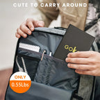 A person slips a slim black notebook labeled "GOK" into a gray backpack pocket, next to the Portable Solar Charger—waterproof, high-efficiency monocrystalline panel—ideal for camping, hiking, travel, and emergency power.