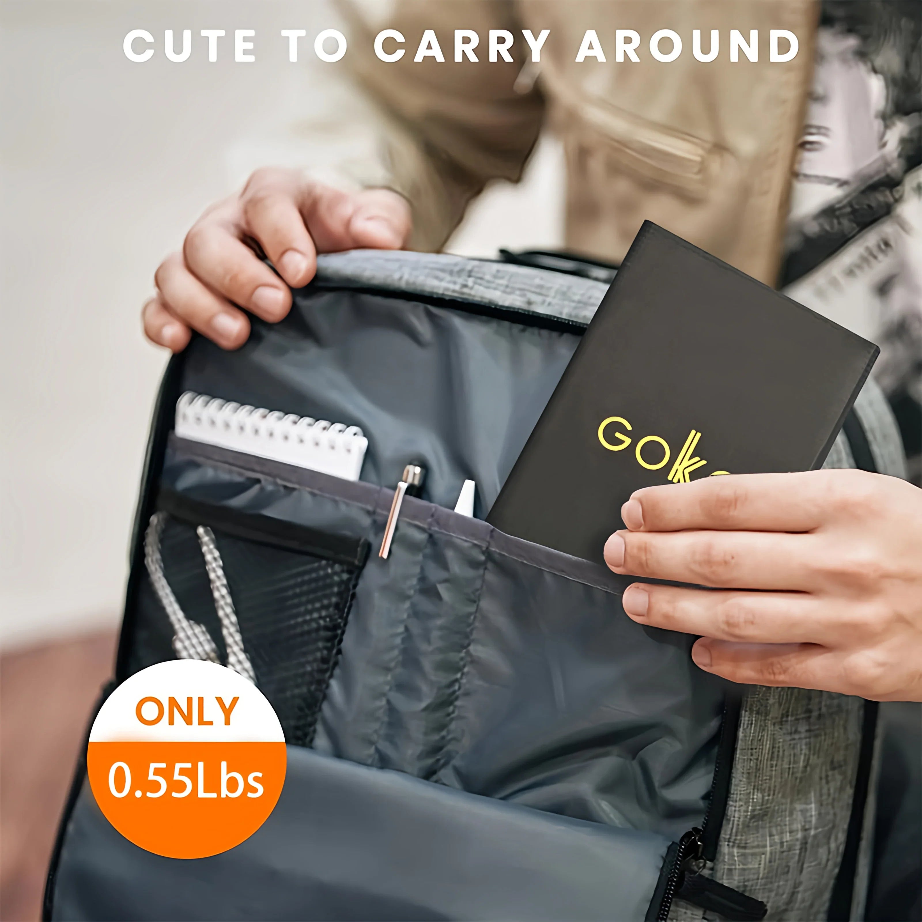A person slips a slim black notebook labeled "GOK" into a gray backpack pocket, next to the Portable Solar Charger—waterproof, high-efficiency monocrystalline panel—ideal for camping, hiking, travel, and emergency power.