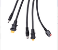 The Renogy 8FT Solar Charging Adapter Cable with Multi DC Connectors features four black cables with barrel, rectangular, and flat connectors—perfect for off-grid solar charging or use with portable power stations.