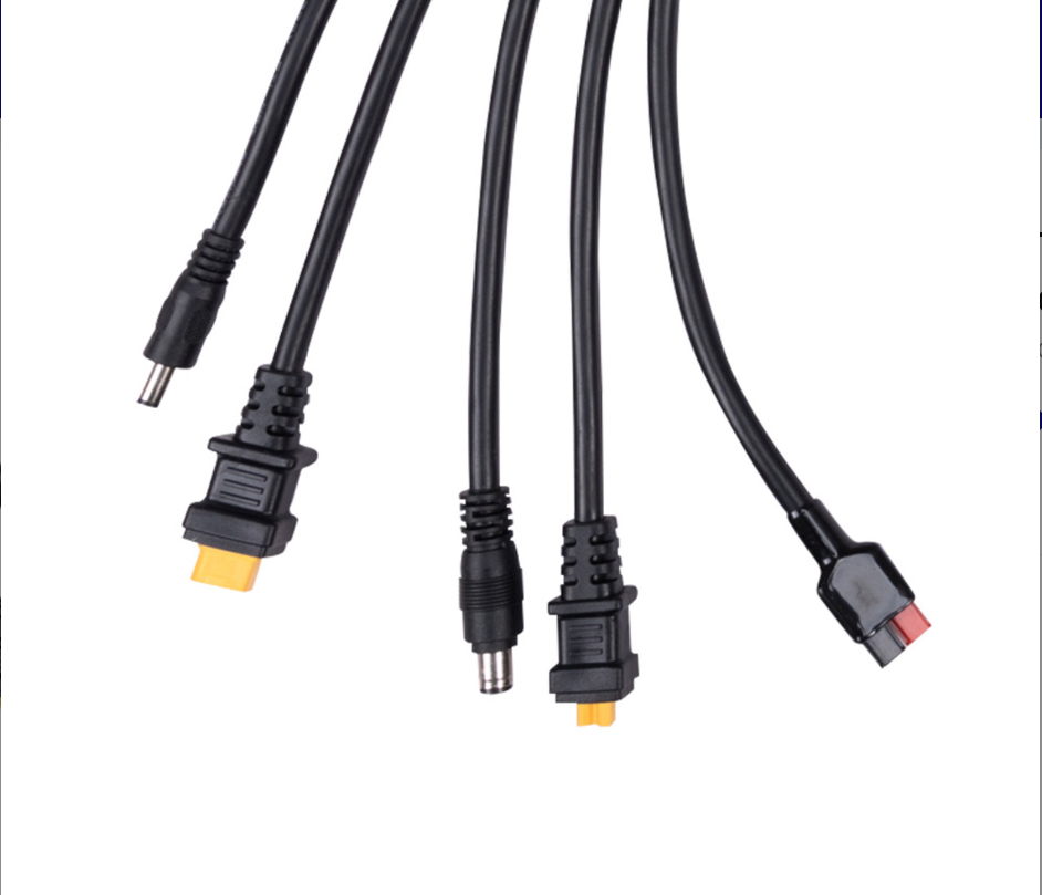 The Renogy 8FT Solar Charging Adapter Cable with Multi DC Connectors features four black cables with barrel, rectangular, and flat connectors—perfect for off-grid solar charging or use with portable power stations.