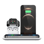 Smartphone, smartwatch, and earbuds  charging on a 4-in-1 charging stand  on a white background with charging display.